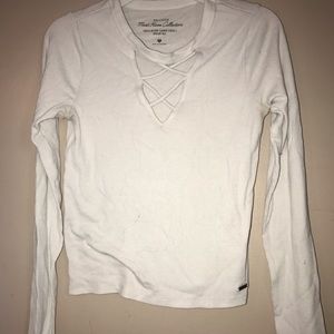 White Long Sleeved Crop Top With Cross Detailing